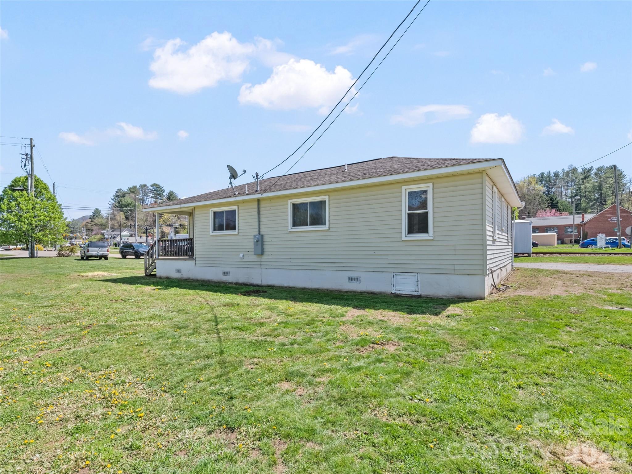 13 Depot Street Clyde, NC 28721 - Photo 5 of 21 a view of a house with a backyard