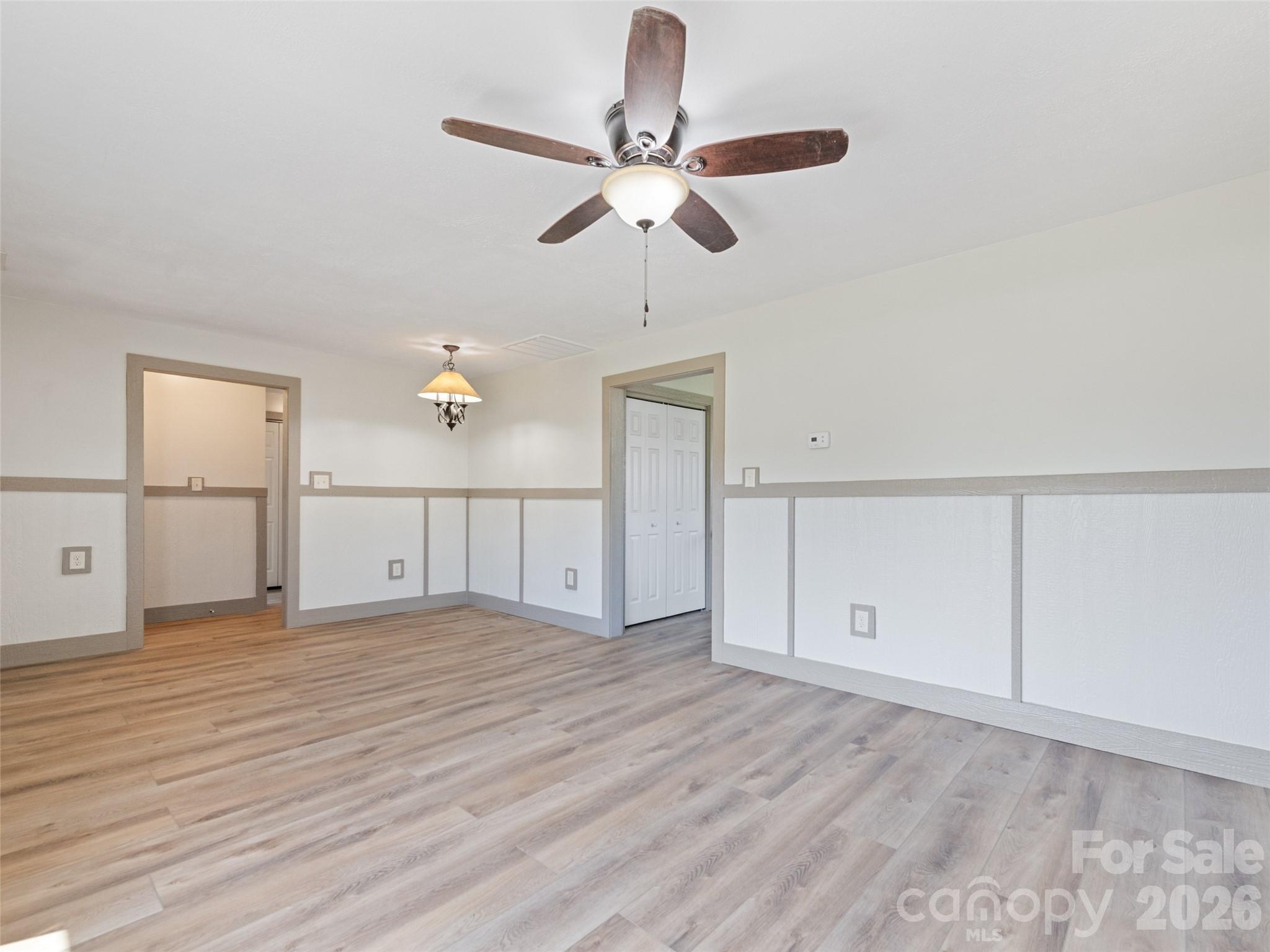 13 Depot Street Clyde, NC 28721 - Photo 8 of 21 a view of a room with cabinet wooden floor and ceiling fan