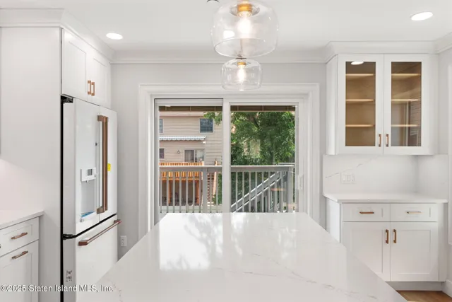 a view of a hallway with windows