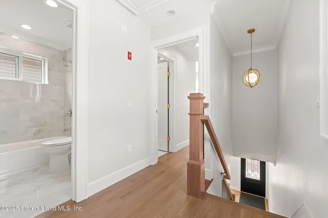a view of a hallway with staircase