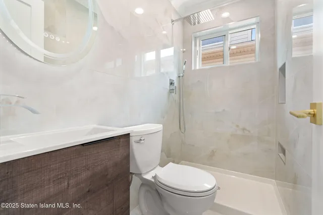 a bathroom with a toilet a sink and bathtub