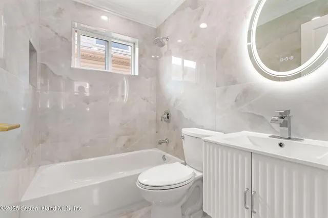 a bathroom with a sink a toilet and a bathtub