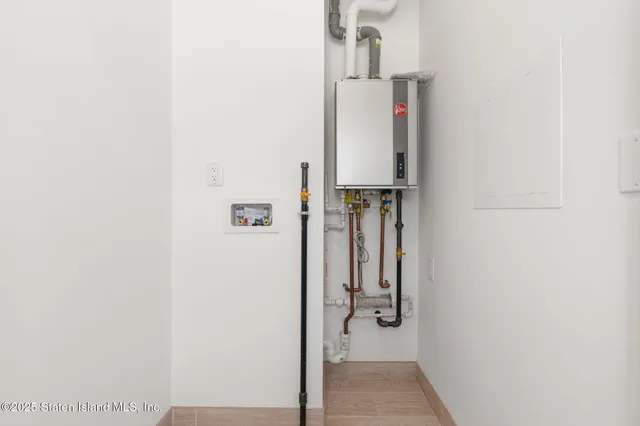 a view of hallway with wooden floor