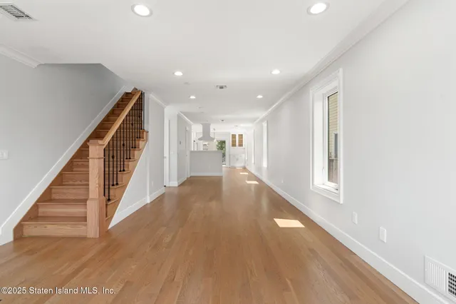 a view of entryway with wooden floor