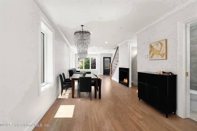 a view of a dining room with furniture window and fireplace
