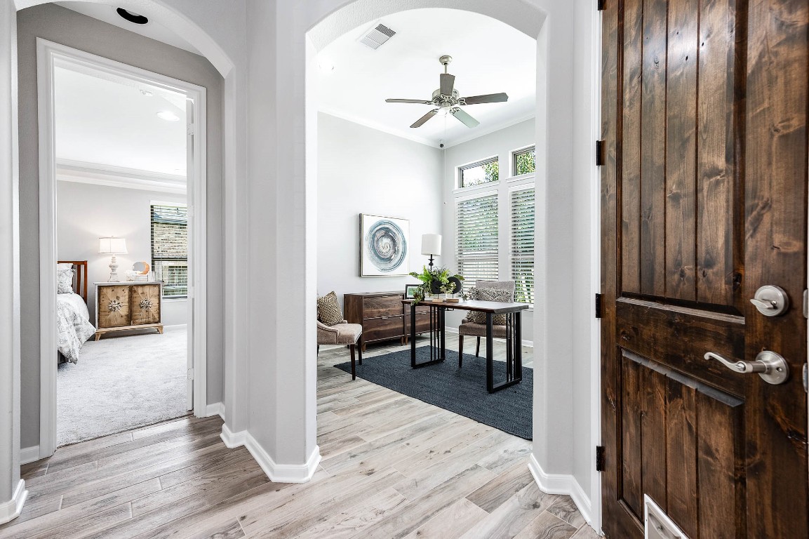 12107 Bayou Junction Road Cypress, TX 77433 - Photo 22 of 45 The home office is located in the back of the house between the den and primary bedroom. There is also a half bath across the hall with a huge storage closet.
