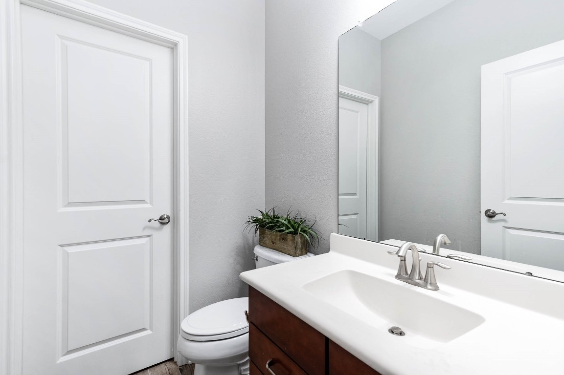 12107 Bayou Junction Road Cypress, TX 77433 - Photo 24 of 45 Half bath is located close to the family room & home office.