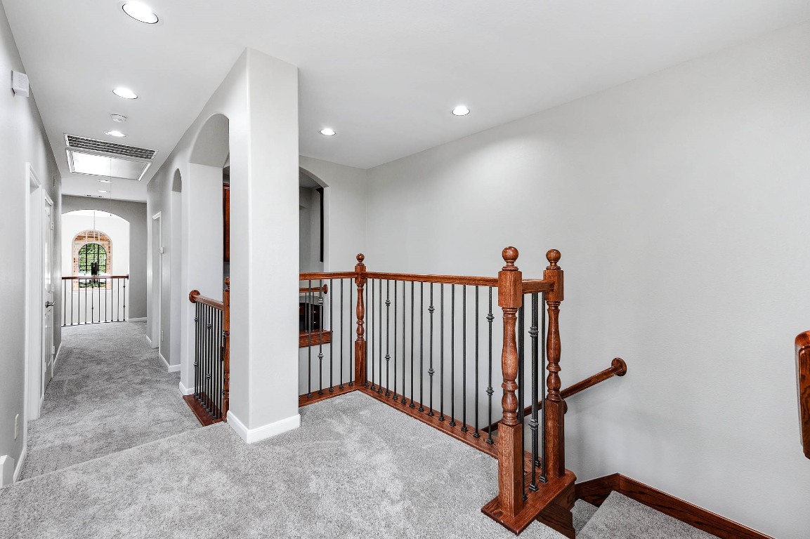 12107 Bayou Junction Road Cypress, TX 77433 - Photo 32 of 45 Stair landing opens up to the game/media room and 2nd floor secondary bedrooms.