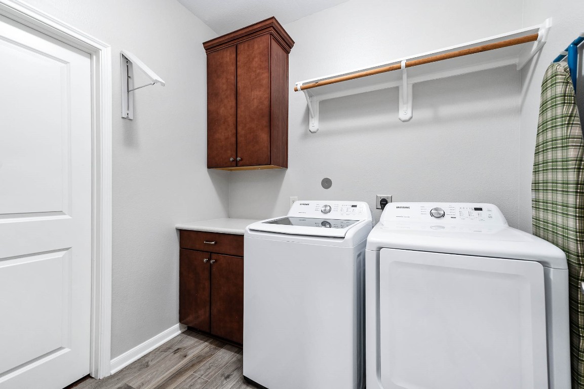 12107 Bayou Junction Road Cypress, TX 77433 - Photo 42 of 45 Laundry room has storage and opens to the master closet.