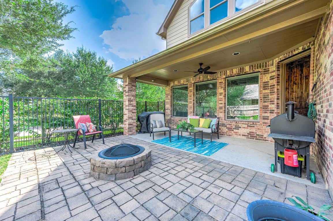12107 Bayou Junction Road Cypress, TX 77433 - Photo 43 of 45 Perfect patio space to end your day and enjoy the fire pit, grilling & chilling.
