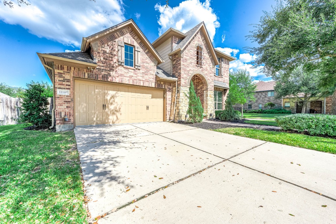 12107 Bayou Junction Road Cypress, TX 77433 - Photo 5 of 45 Double wide driveway will hold 4 cars plus garage parking, perfect for families with multiple drivers.