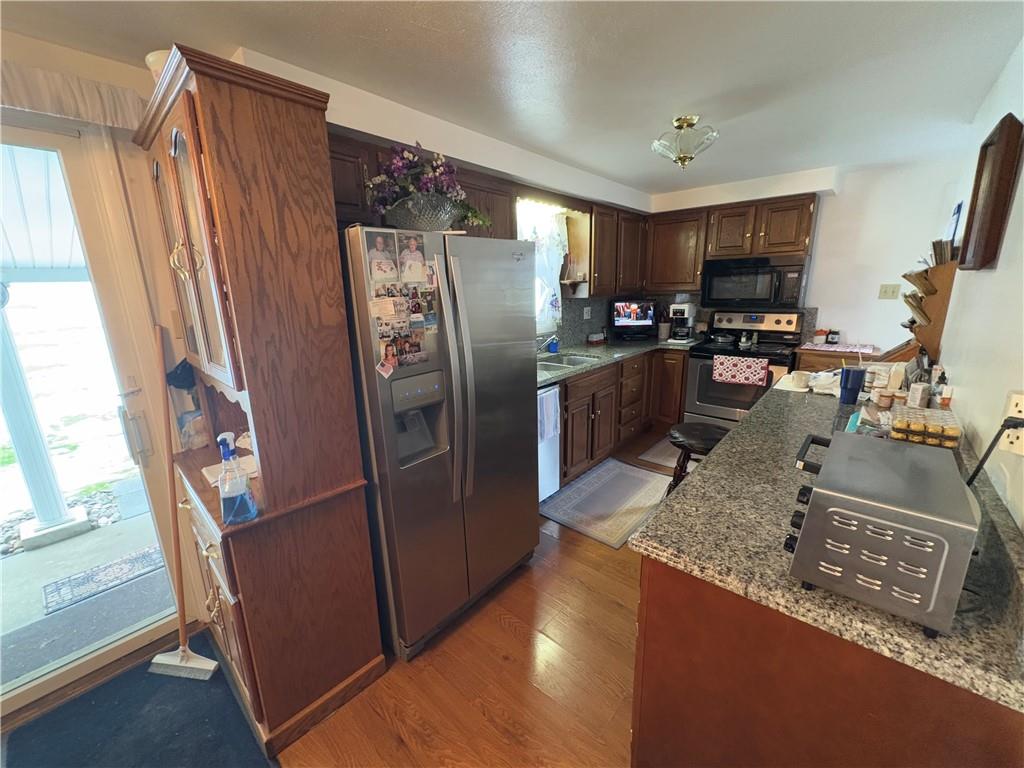 962 Reed Road Mayport, PA 16240 - Photo 7 of 22 a kitchen with stainless steel appliances granite countertop a refrigerator and a sink