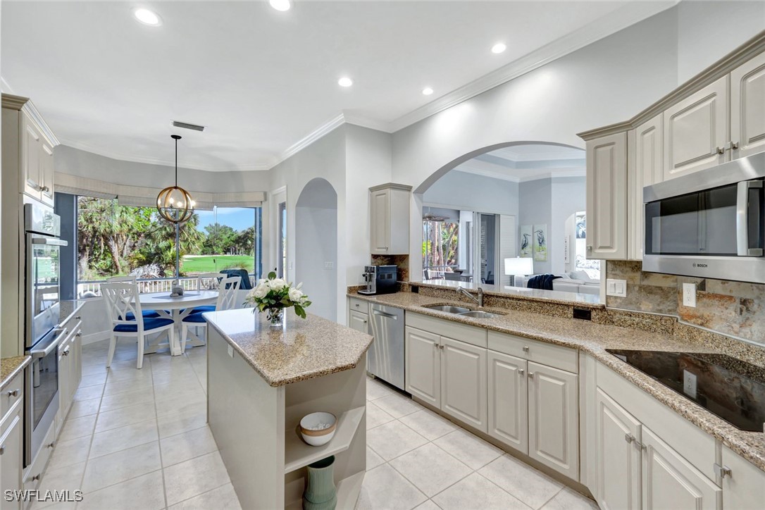 2450 Wulfert Road Sanibel, FL 33957 - Photo 21 of 44 a large kitchen with a lot of counter space and a sink