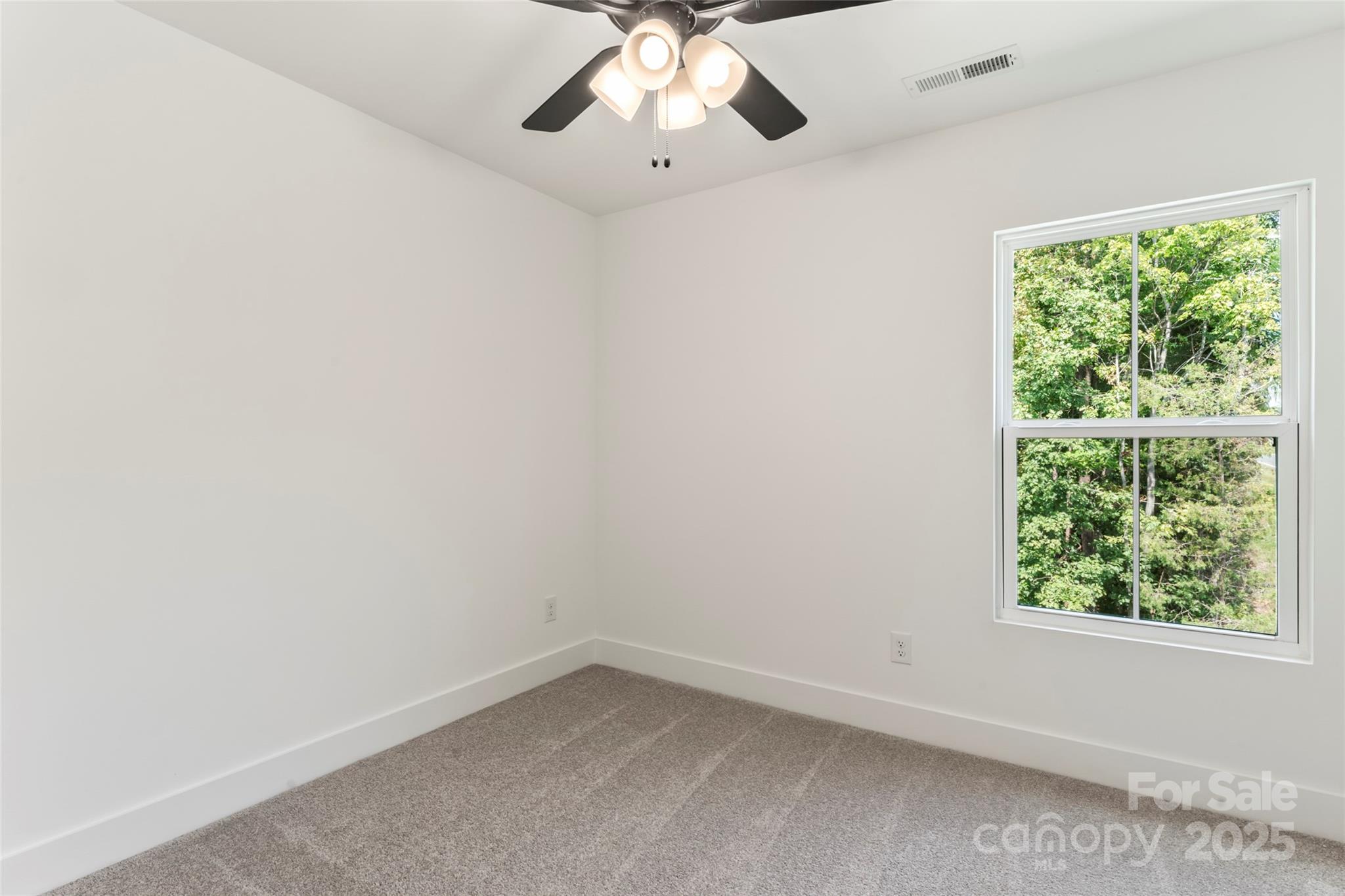 309 Yaupon Court, Unit 17 Fort Mill, SC 29708 - Photo 26 of 43 an empty room with a window