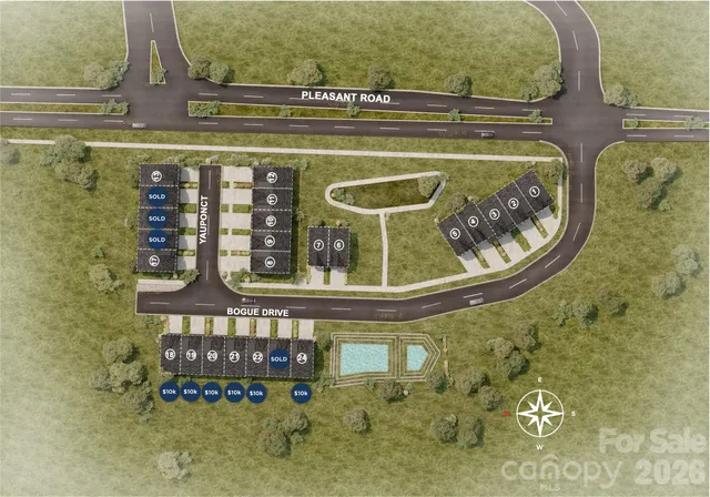 a bedroom with a large white bed and a large window