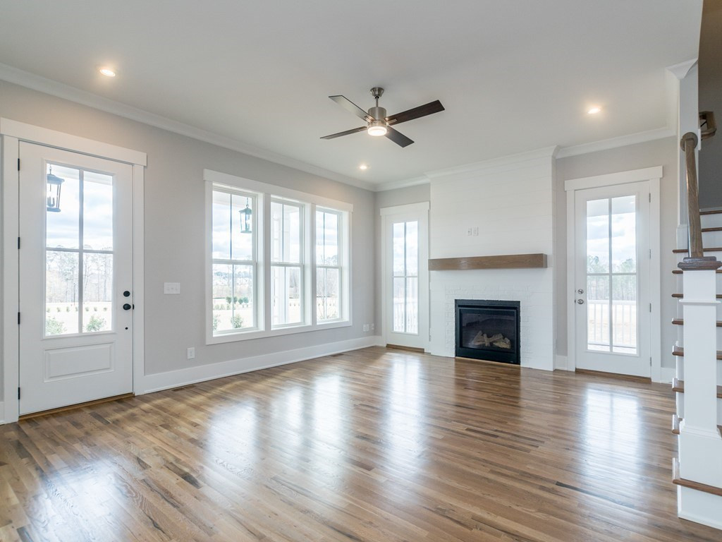 Living room offers plenty of natural light. Views of the park from the porch, screened porch, and living room. Living Room