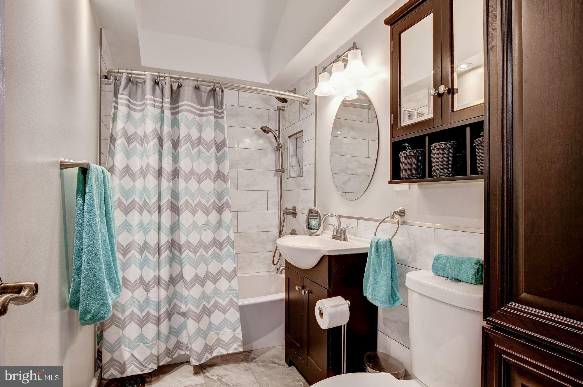 1300 Silo Way Silver Spring, MD 20905 - Photo 18 of 30 UL hall bath, updated tile, vanity, hardware