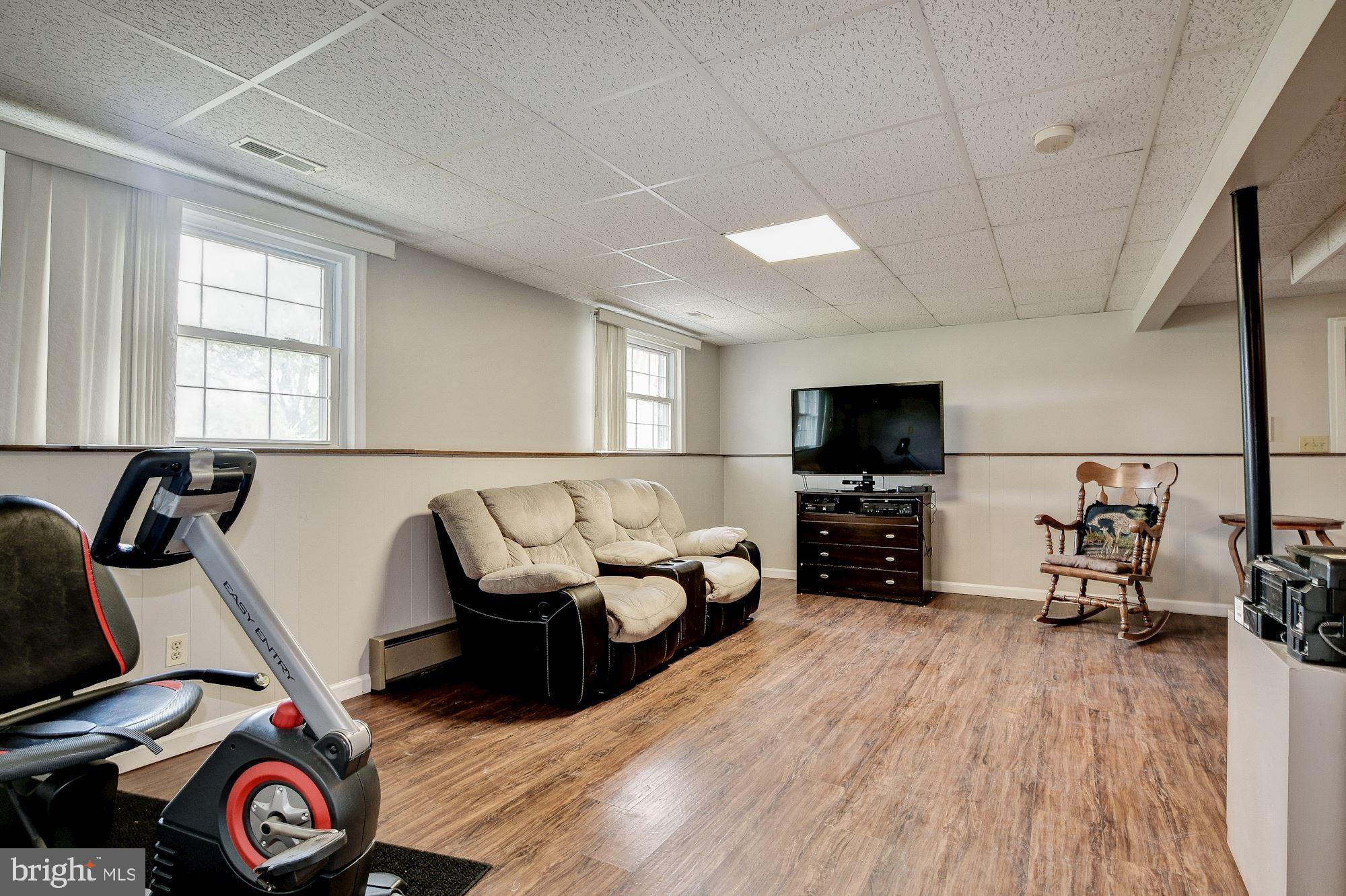 1300 Silo Way Silver Spring, MD 20905 - Photo 22 of 30 Family room downstairs, nice light