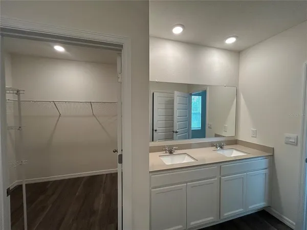 a bathroom with a sink and mirror