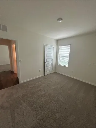 a view of a room that has a window