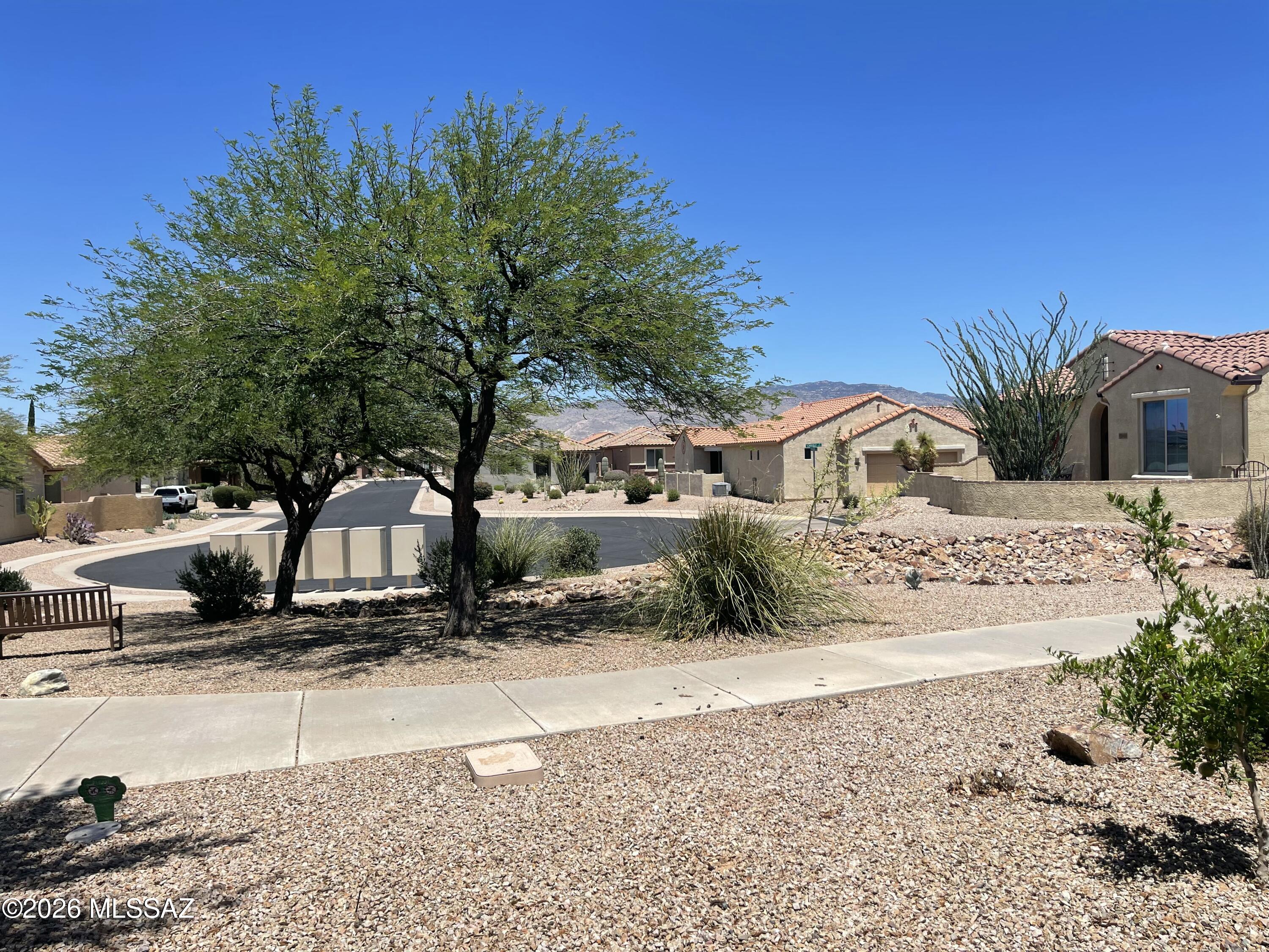 13991 East Cheavront Loop Vail, AZ 85641 - Photo 44 of 47 a view of a house with a yard