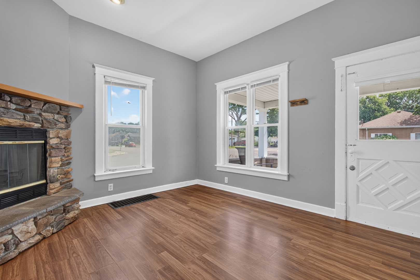 1128 Butler Street Morris, IL 60450 - Photo 6 of 28 a view of an empty room with wooden floor and a window