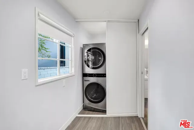 a view of a hallway with washer and dryer