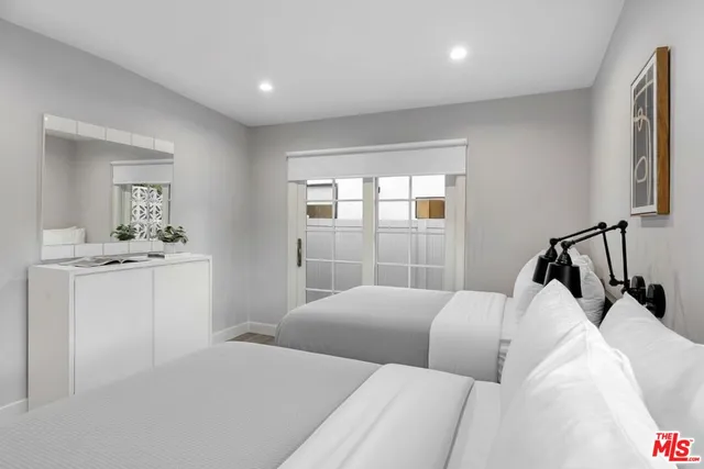 a bedroom with a bed and a table