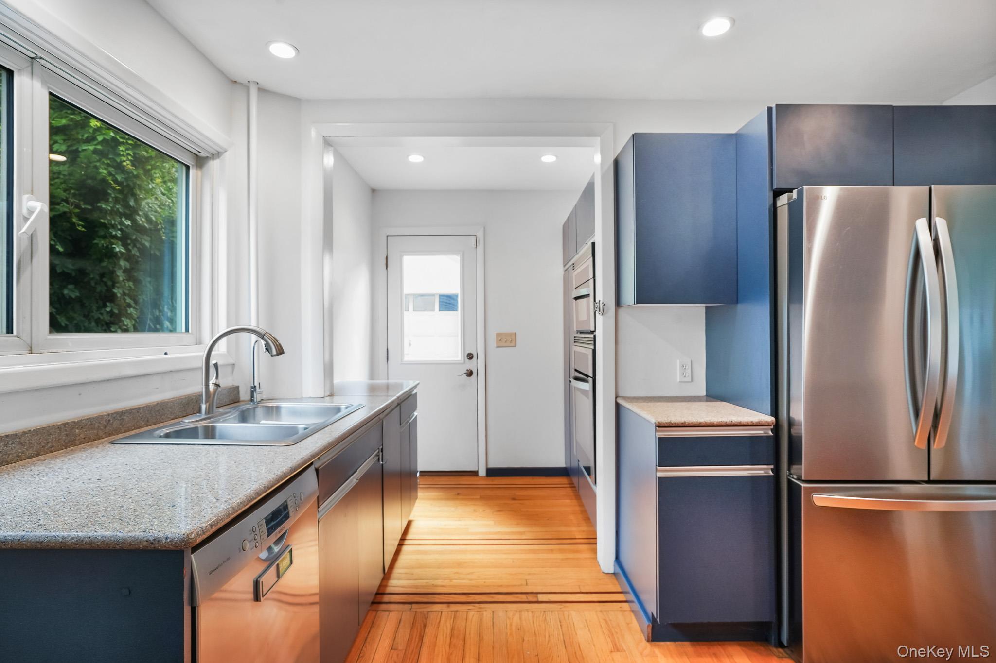 211 Pomeroy Street Peekskill, NY 10566 - Photo 16 of 50 kitchen complete with granite countertops, soft-close cabinetry, stainless steel appliances