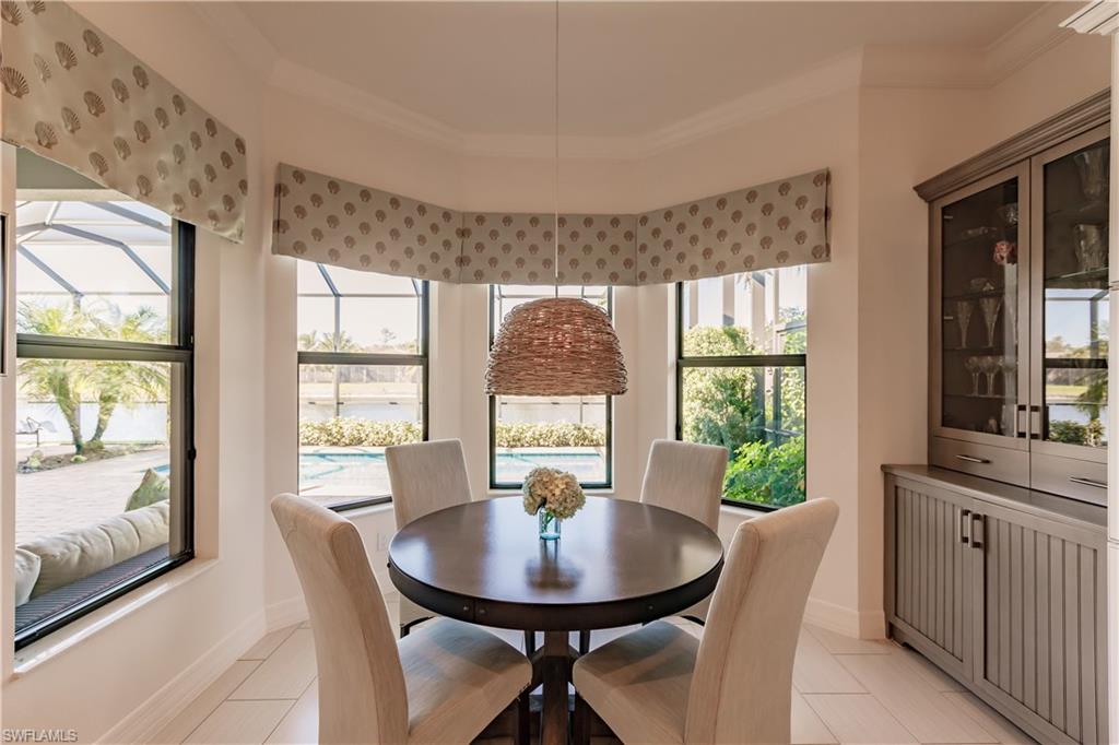 3432 Atlantic Circle Naples, FL 34119 - Photo 15 of 31 a view of a dining room with furniture window and outside view