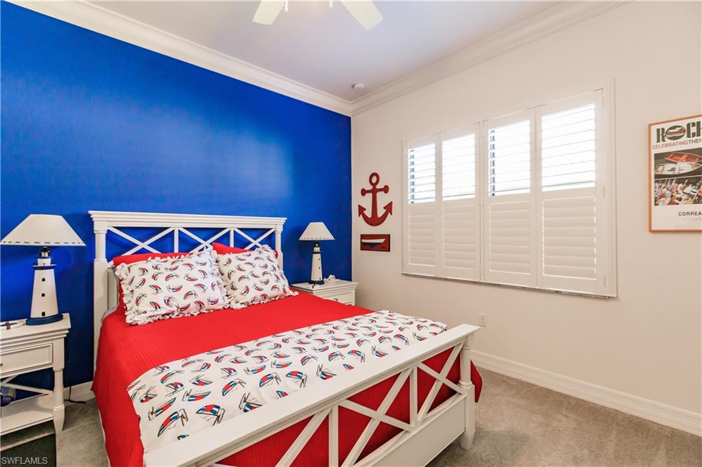 3432 Atlantic Circle Naples, FL 34119 - Photo 24 of 31 a bedroom with a bed and a dresser