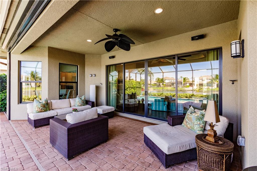3432 Atlantic Circle Naples, FL 34119 - Photo 28 of 31 a living room with furniture and a large window