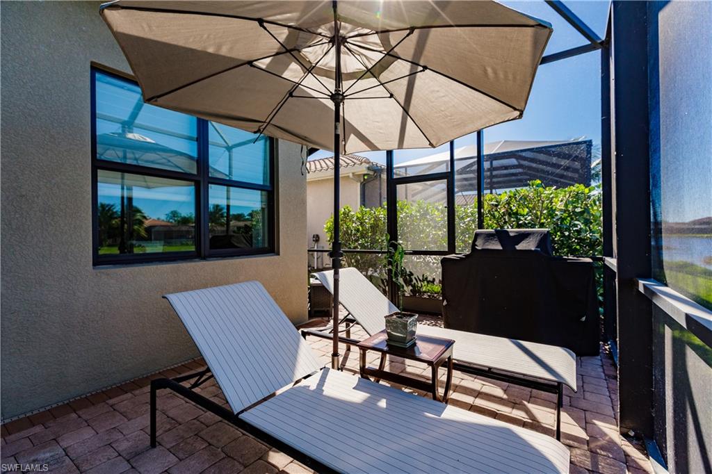3432 Atlantic Circle Naples, FL 34119 - Photo 29 of 31 a view of a chairs and table in the balcony