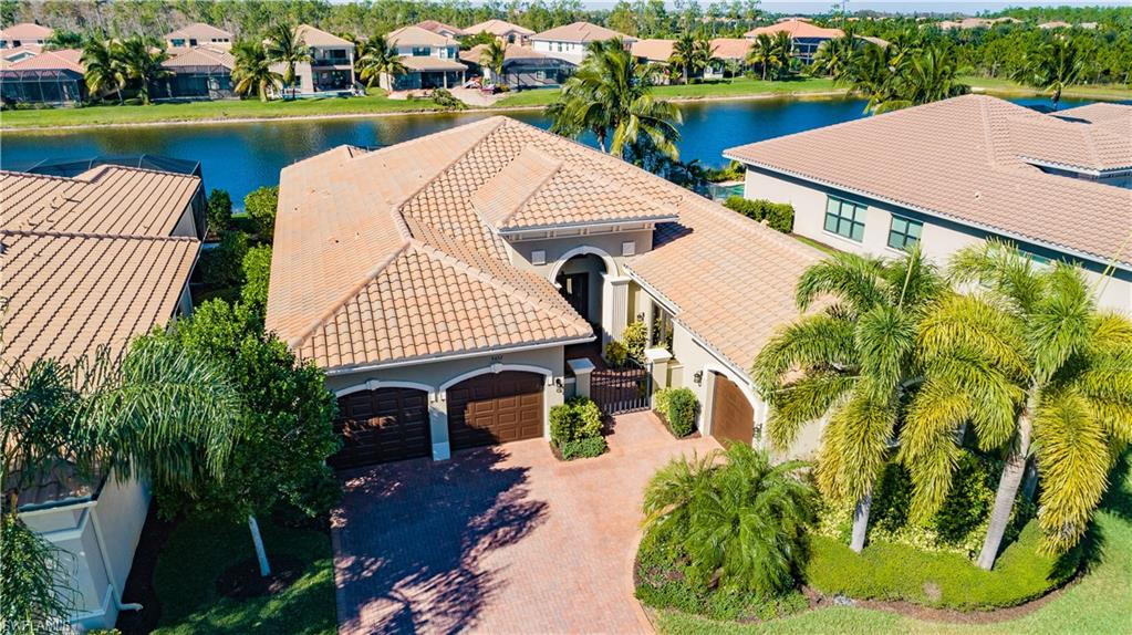 3432 Atlantic Circle Naples, FL 34119 - Photo 31 of 31 a aerial view of a house with a garden and plants