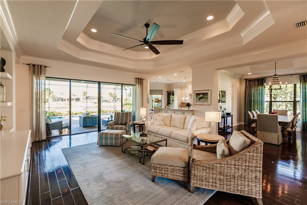 3432 Atlantic Circle Naples, FL 34119 - Photo 4 of 31 a living room with furniture and a large window