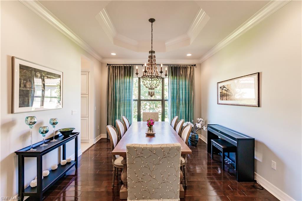 3432 Atlantic Circle Naples, FL 34119 - Photo 6 of 31 a living room with furniture large window and wooden floor
