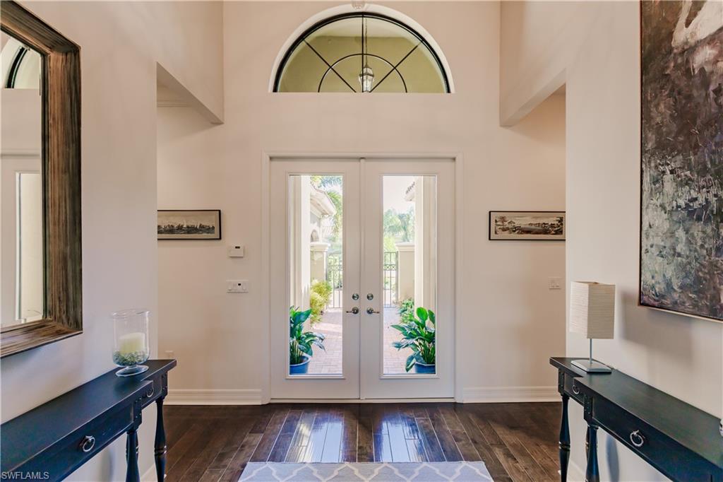 3432 Atlantic Circle Naples, FL 34119 - Photo 10 of 31 a view of entryway with wooden floor