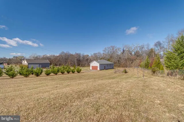 a big room with yard and mountain view in back