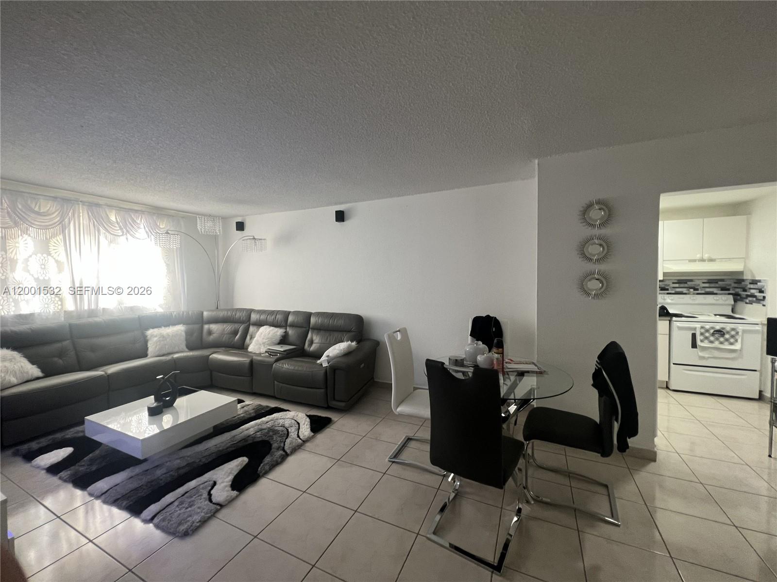 666 West 81st Street, Unit 407 Hialeah, FL 33014 - Photo 2 of 9 a living room with furniture