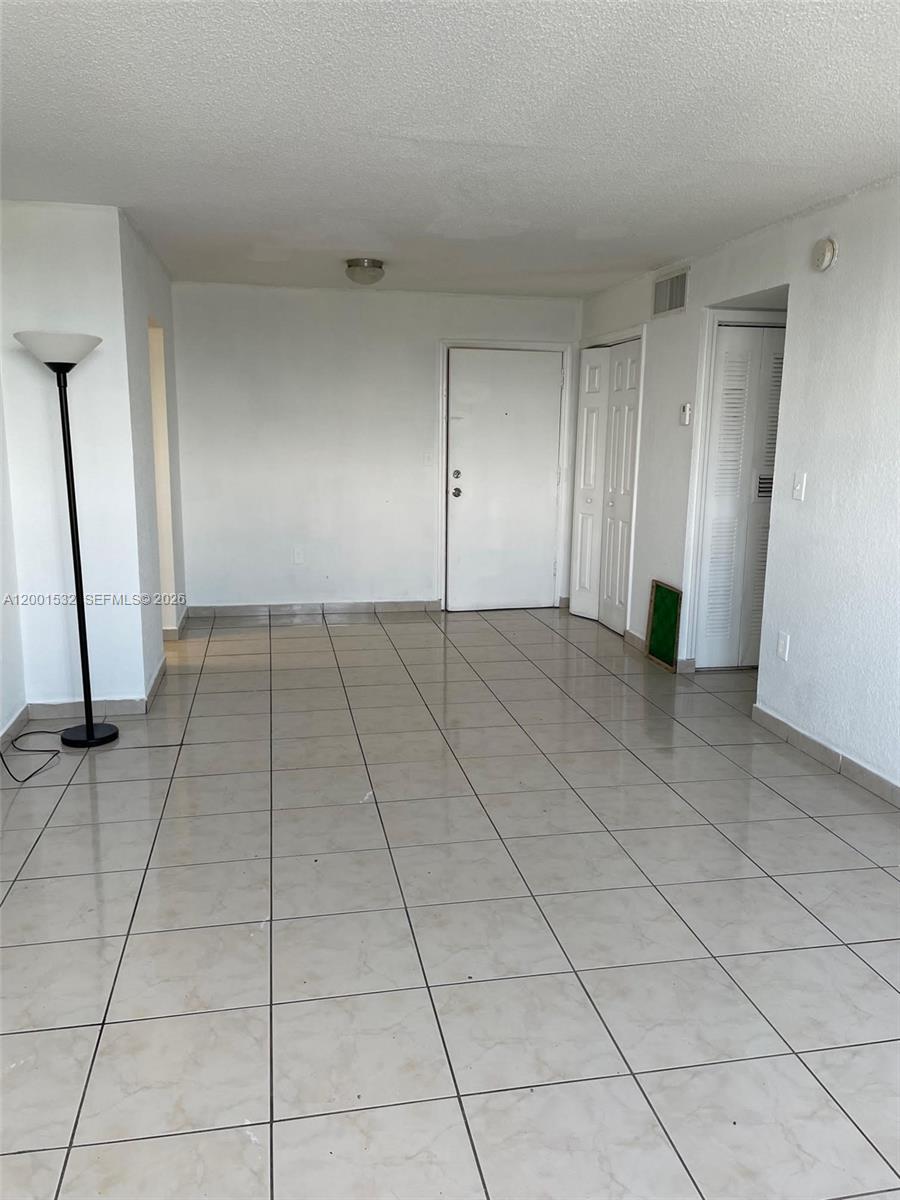 666 West 81st Street, Unit 407 Hialeah, FL 33014 - Photo 5 of 9 a view of an empty room with entrance
