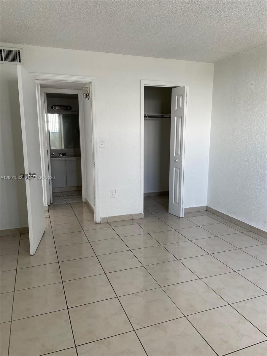 666 West 81st Street, Unit 407 Hialeah, FL 33014 - Photo 6 of 9 a view of an empty room & window