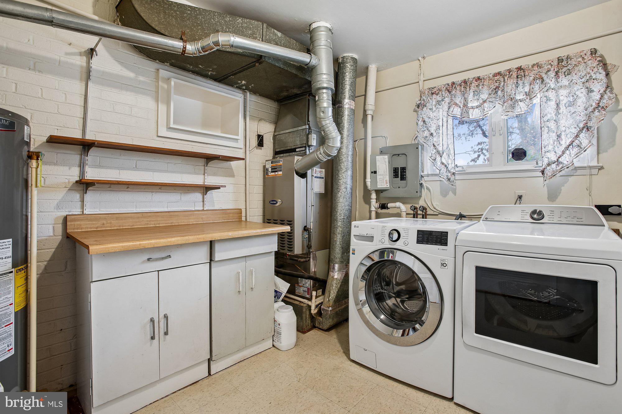 6621 Edsall Road Springfield, VA 22151 - Photo 15 of 42 a utility room with dryer and washer