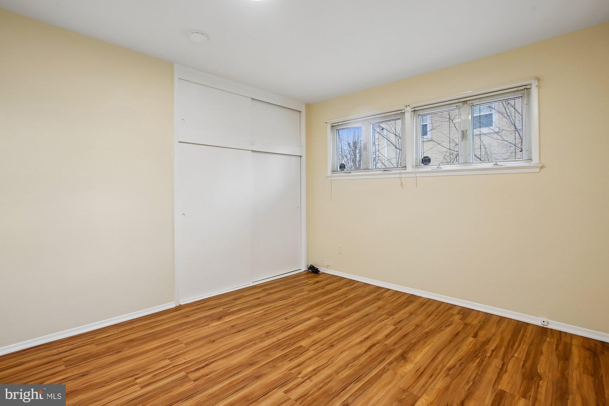 6621 Edsall Road Springfield, VA 22151 - Photo 17 of 42 a view of a room with wooden floor and wall painting