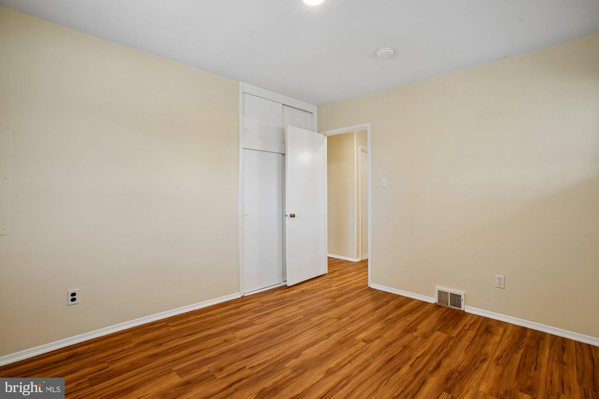 6621 Edsall Road Springfield, VA 22151 - Photo 19 of 42 a view of empty room with wooden floor