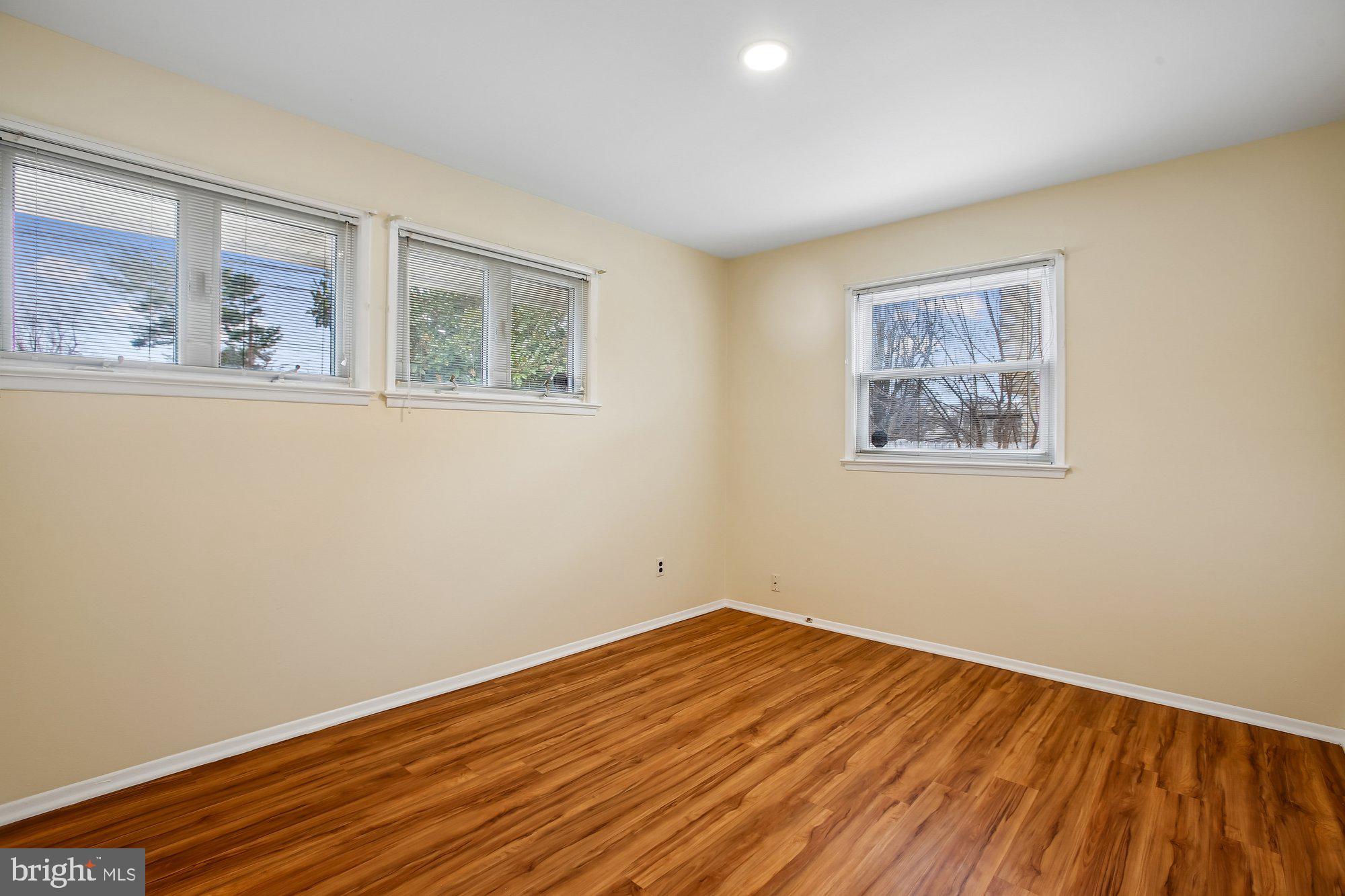 6621 Edsall Road Springfield, VA 22151 - Photo 22 of 42 a view of empty room with wooden floor and fan