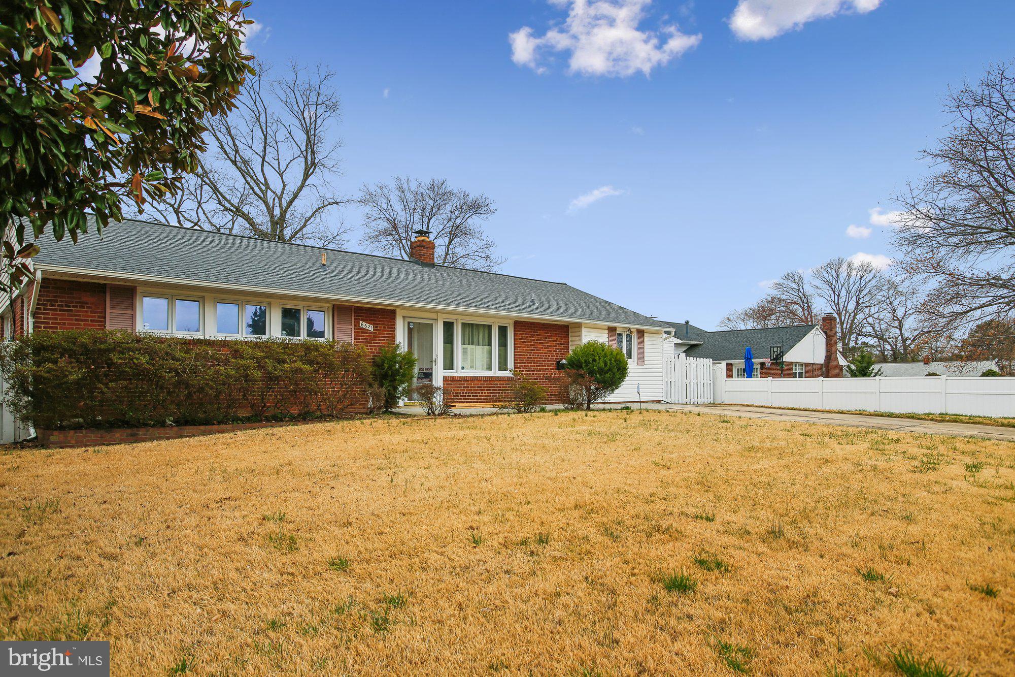 6621 Edsall Road Springfield, VA 22151 - Photo 26 of 42 a view of a house with a yard and garage