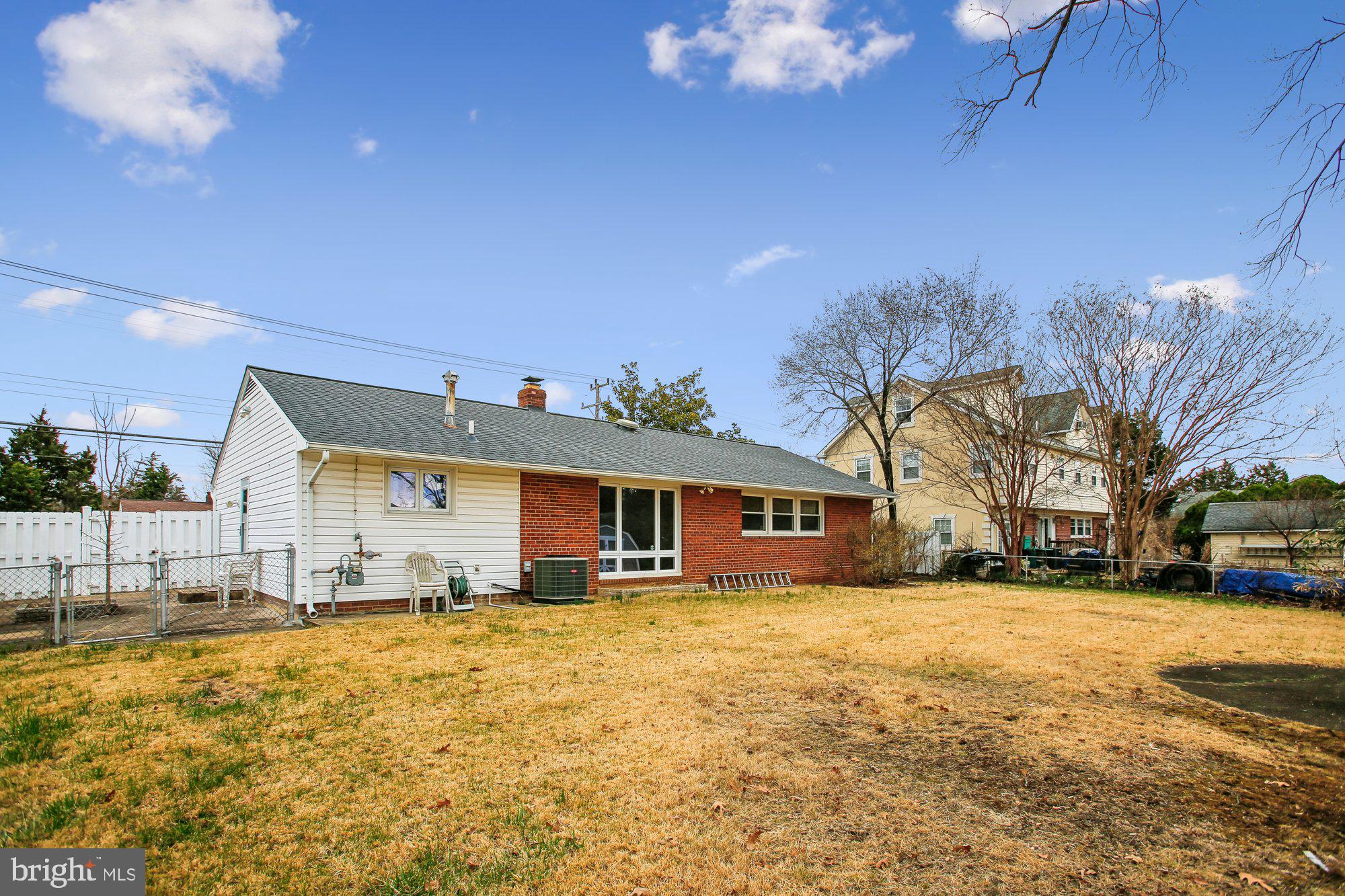 6621 Edsall Road Springfield, VA 22151 - Photo 27 of 42 a front view of residential houses with yard and trees