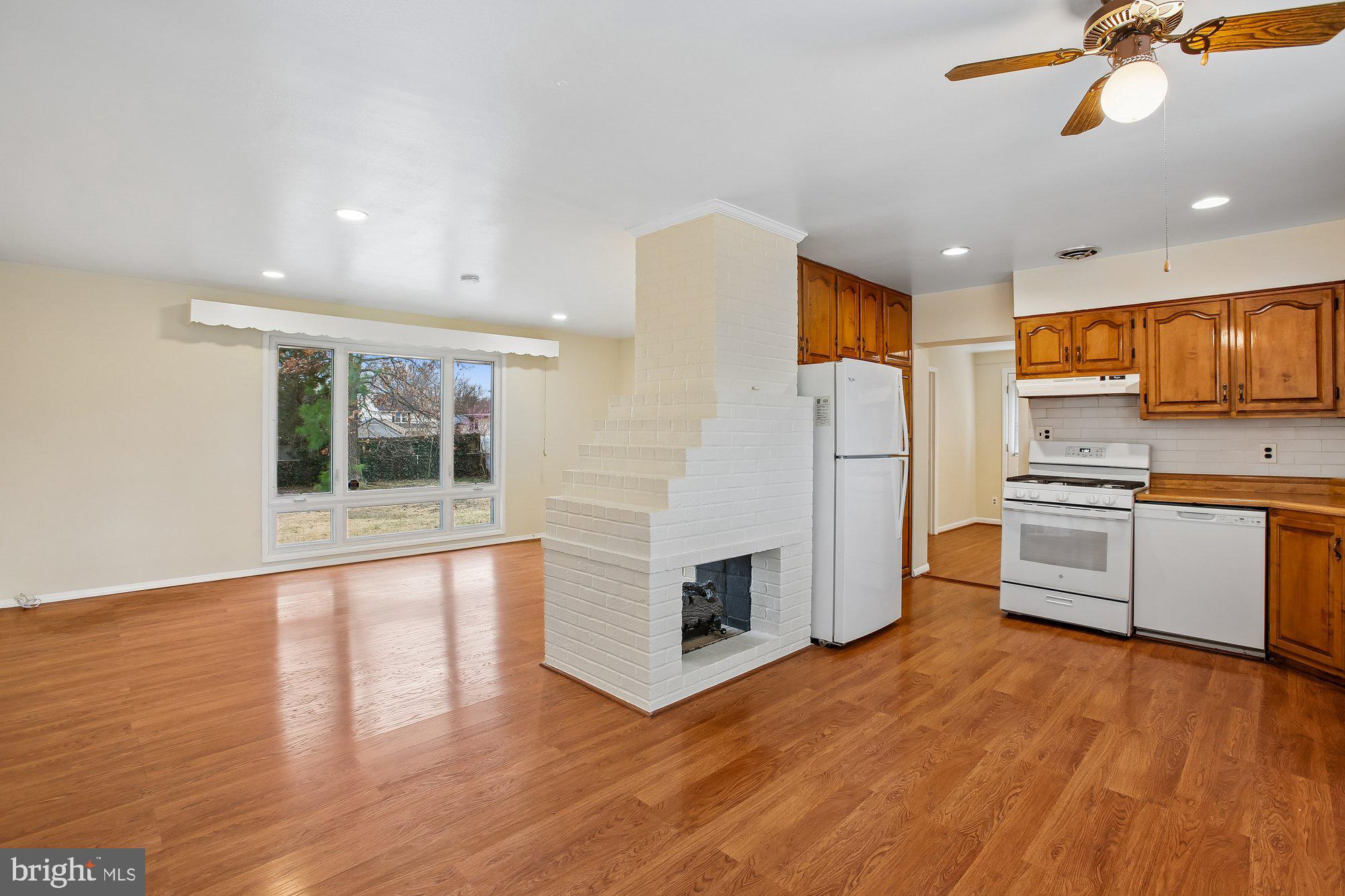 6621 Edsall Road Springfield, VA 22151 - Photo 6 of 42 a kitchen with stainless steel appliances a refrigerator and a stove top oven