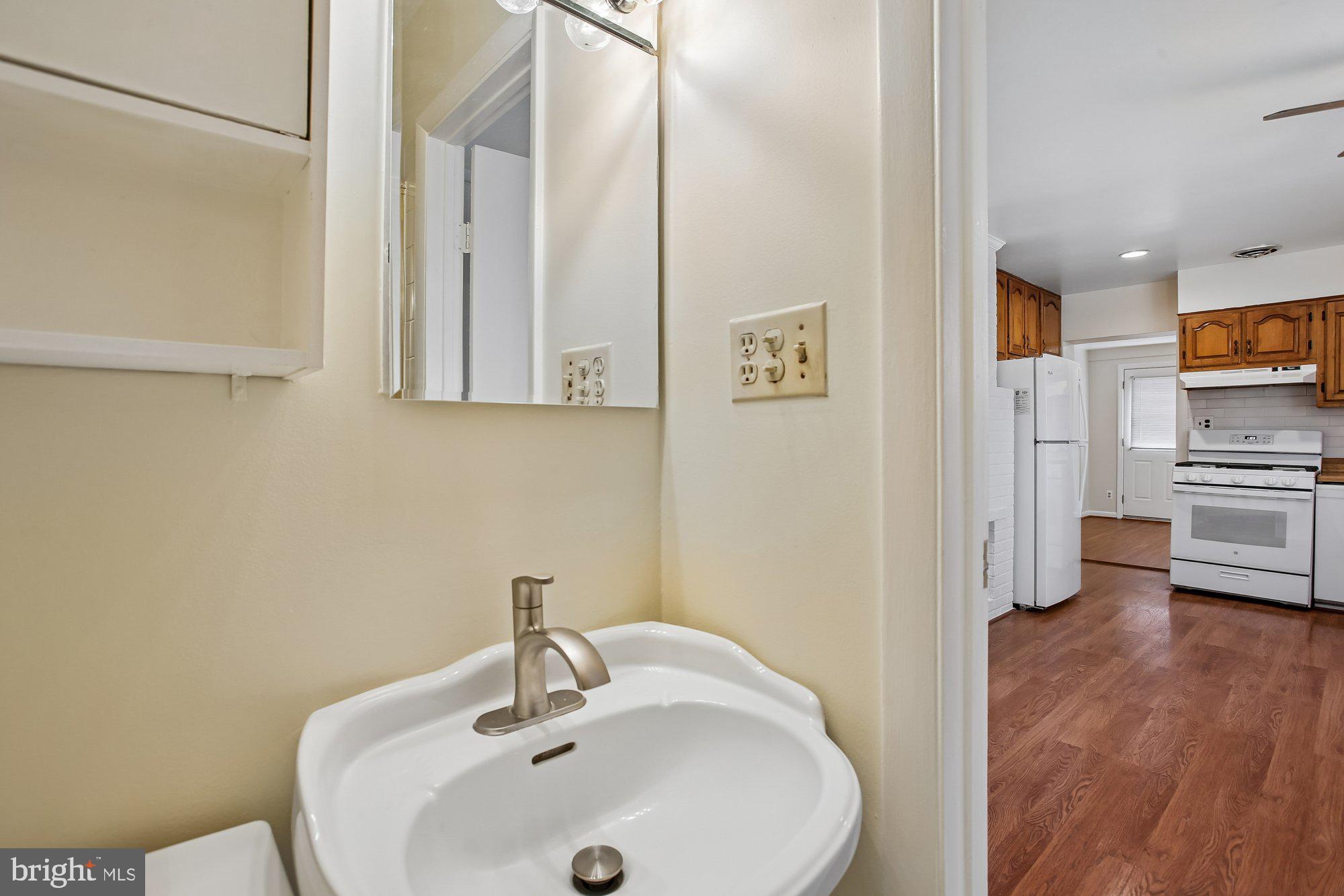 6621 Edsall Road Springfield, VA 22151 - Photo 10 of 42 a bathroom with a sink and a mirror