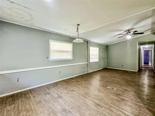 a kitchen with a sink a window and cabinets